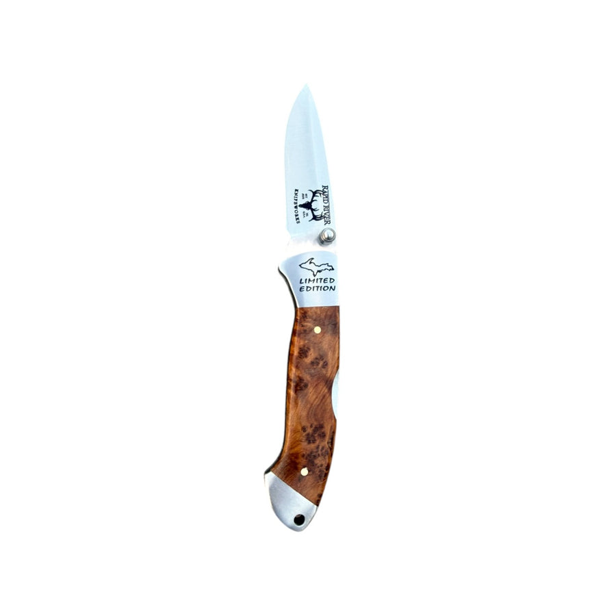 Open Thuya wood Yooper pocket knife 26-559 with a figured brown handle and Limited Edition blade engraving