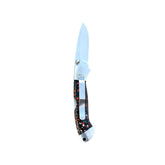 Reverse side of the open Monarch Polyclast Yooper pocket knife 26-556, showing the silver pocket clip and multicolored handle