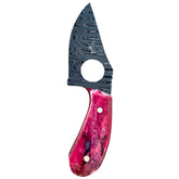 A small fixed-blade knife with a dark gray and black wavy Damascus-style blade and a vibrant pink handle, shown against a plain white background.