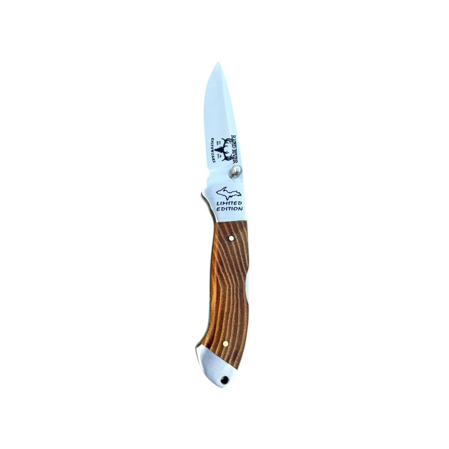 Open Osage orange wood Yooper pocket knife 26-560 with a striped wood handle and Limited Edition blade engraving.