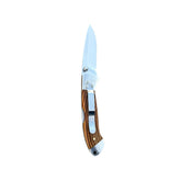 Reverse side of the open Osage orange wood Yooper pocket knife 26-560, showing the silver pocket clip and wood grain