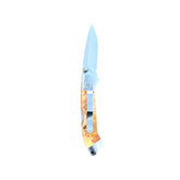Reverse side of Yooper pocket knife 26-544 with blade open, yellow-orange box elder burl handle and silver pocket clip.