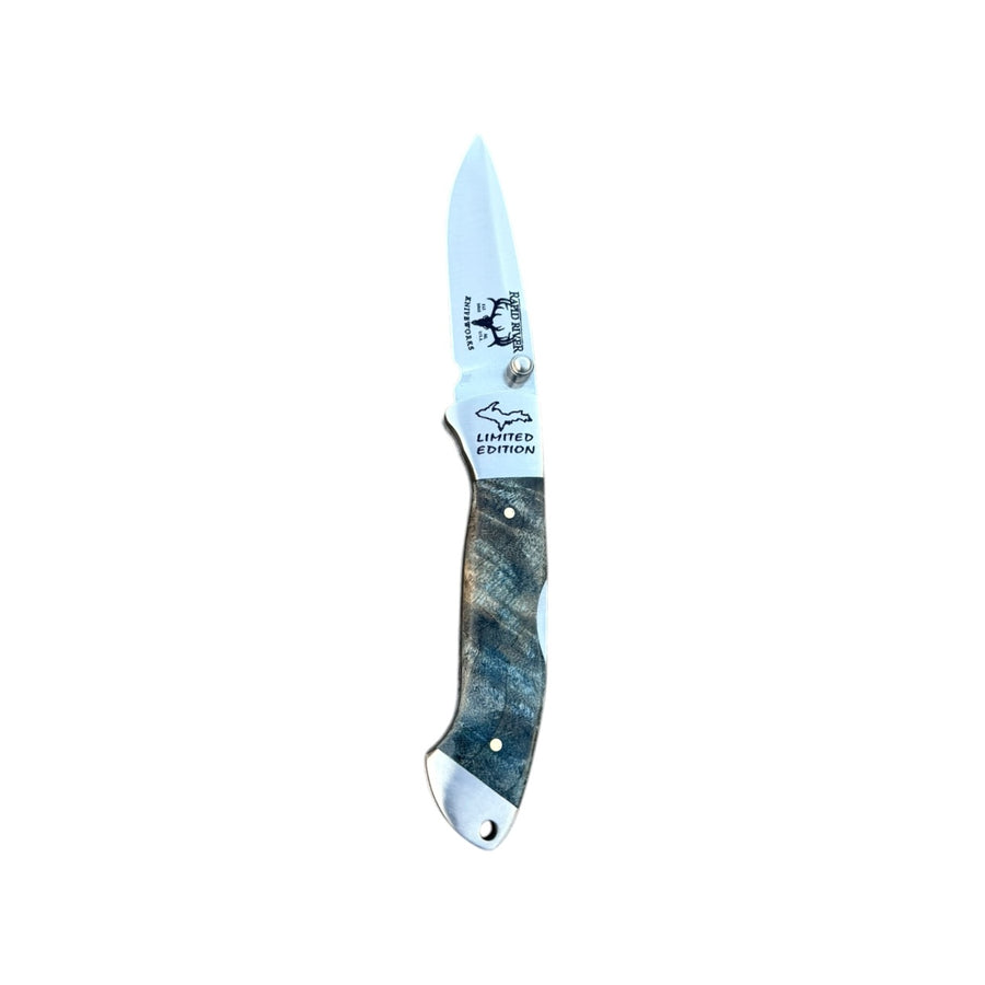 Yooper pocket knife 26-549 with blade open, blue-gray dyed box elder burl handle and Limited Edition blade marking