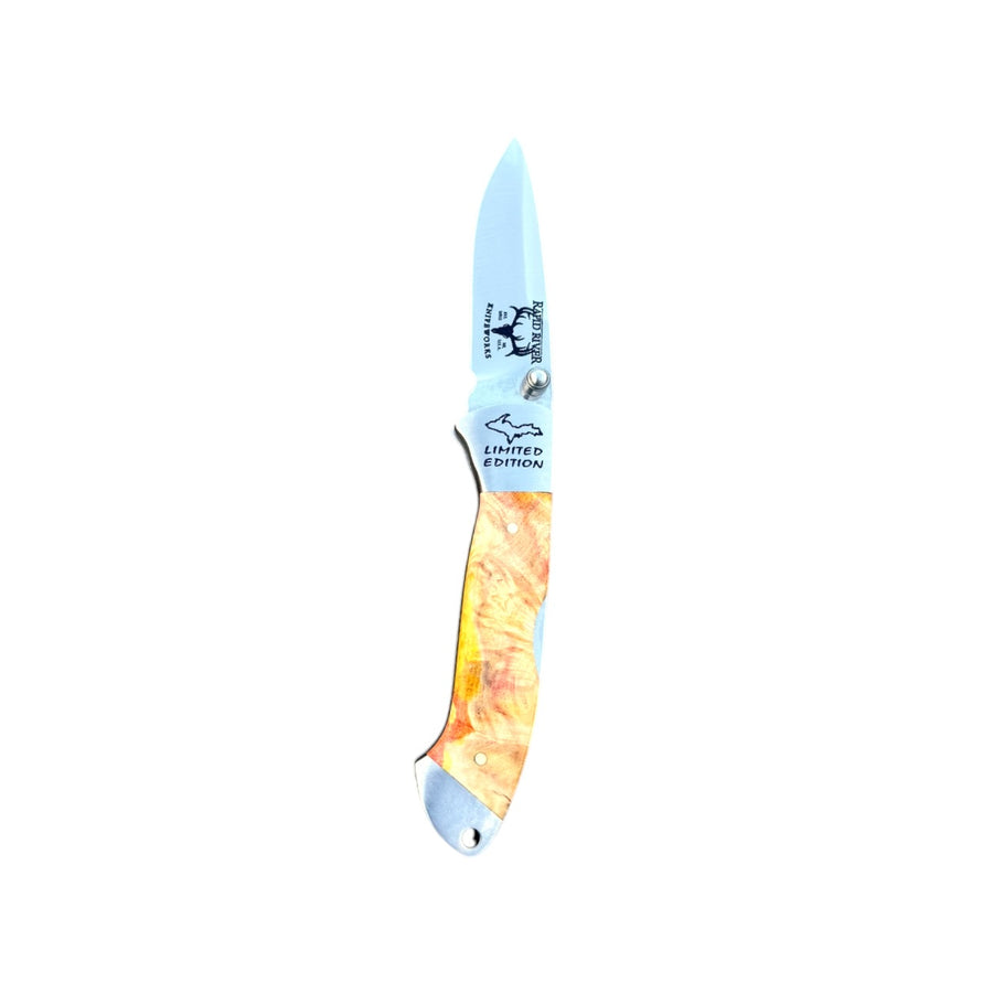 Yooper pocket knife 26-544 with blade open, yellow-orange box elder burl handle and Limited Edition blade marking